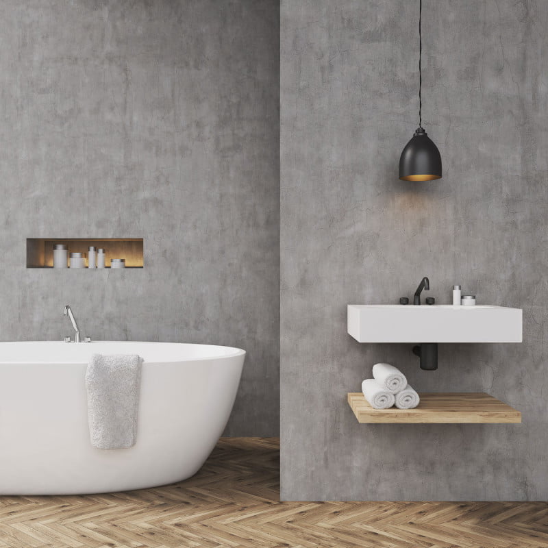 Stuccomeister RVS Spaan Betonlook wand in badkamer sfeerafbeelding